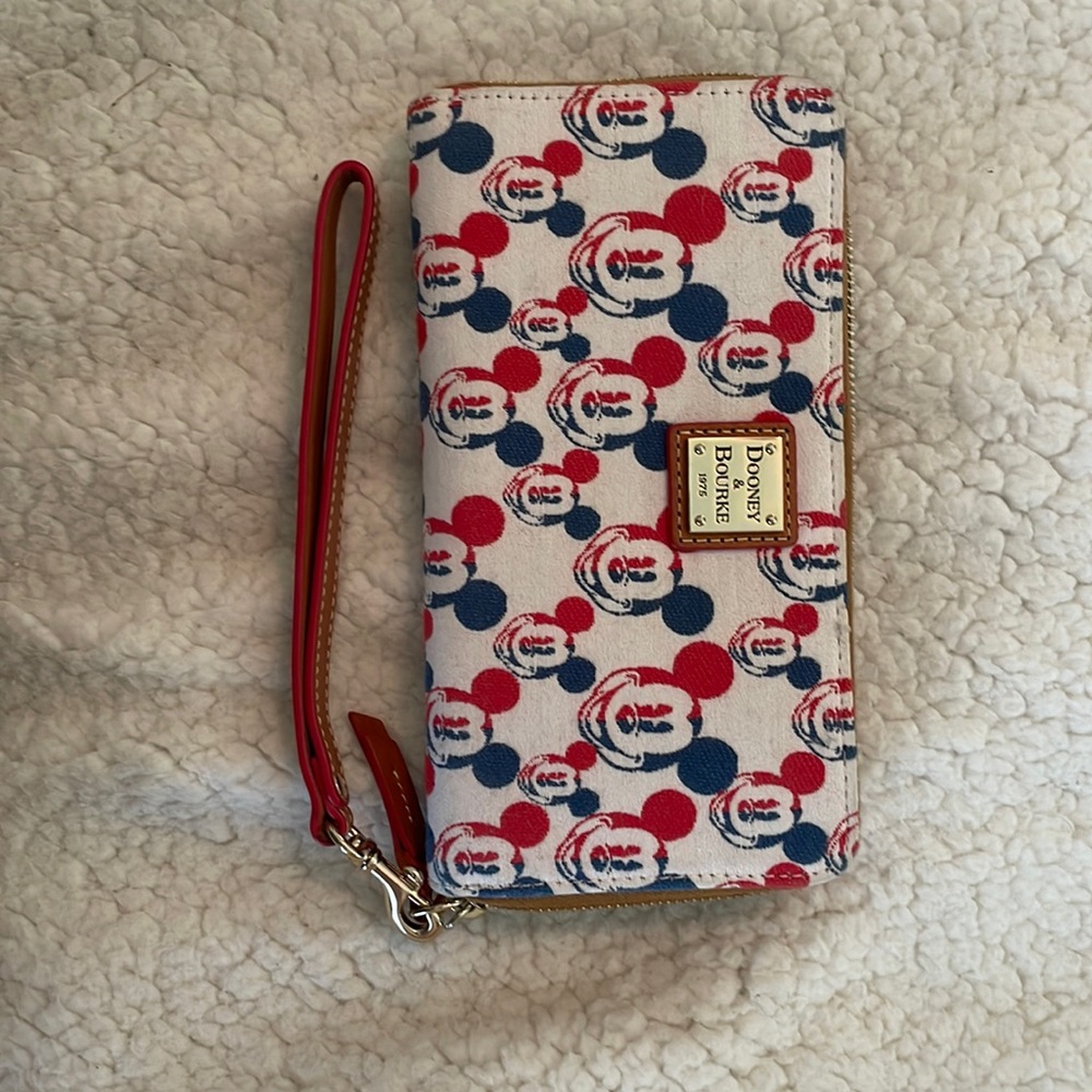 Gently used patriotic Mikey Disney Dooney & Bourke wristlet wallet